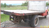 Go to 1955 Chevy Series 6400 2 ton flatbed farm truck right rear view