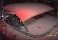 1957 Chevrolet Corvette 283 CID Fuel Injection V-8 left rear view