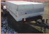 1980's tandem axle trailer with Coleman pop-up camper and toy hauler rear deck for sale $4,500
